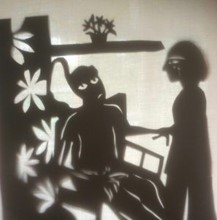 Sepia drawing representing a person caring for someone in a wheelchair.